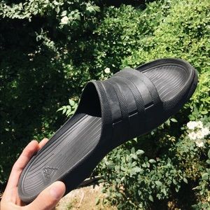 Black adidas slides